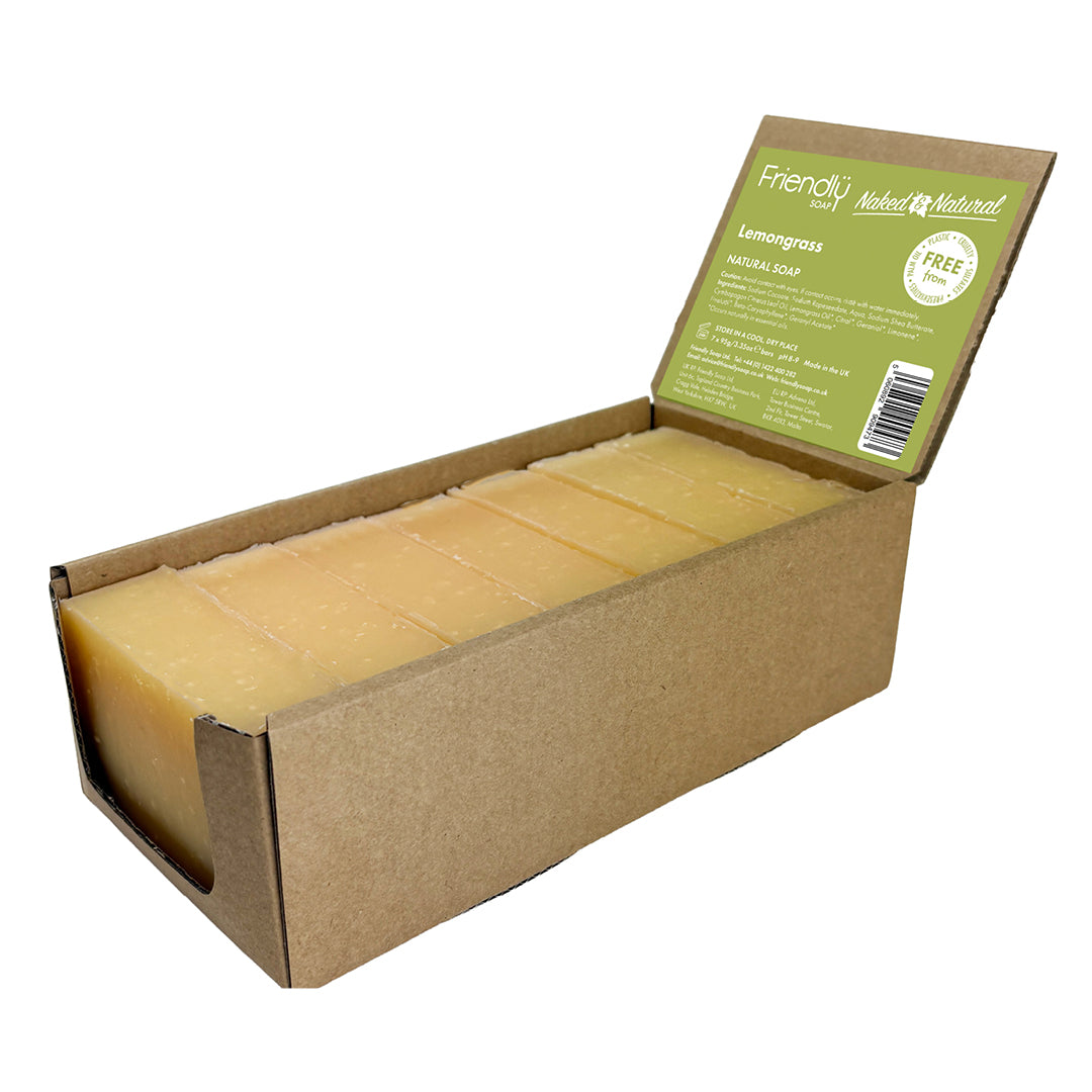 A cardboard box of Lemongrass Natural Soap, showing seven rectangular bars of pale yellow soap inside an open brown kraft box with a green product label.