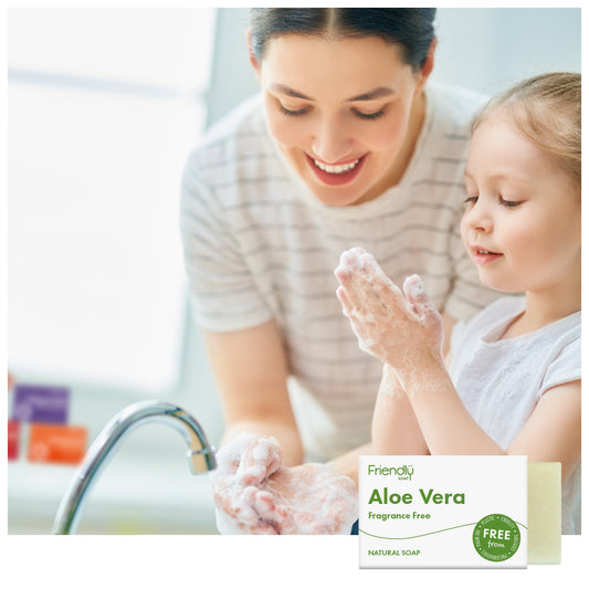 mum and child having fun washing their hands at the kitchen sink