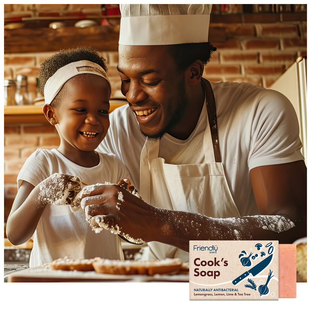 father and daughter enjoying baking together in the kitchen with a friendly soap cook's soap bar