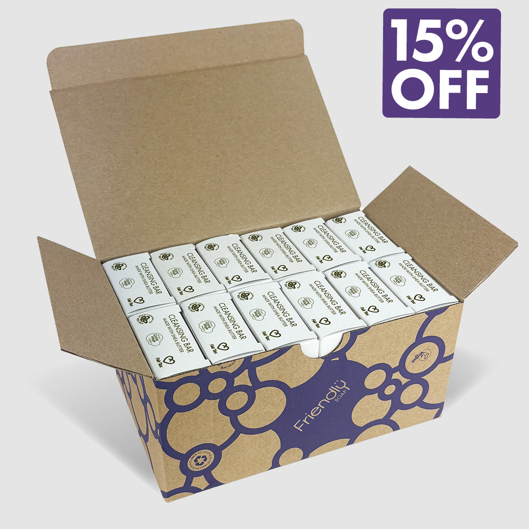 An open kraft cardboard box filled with 12 fragrance free cleansing bars, with a purple '15% OFF' promotional badge in the top right corner.