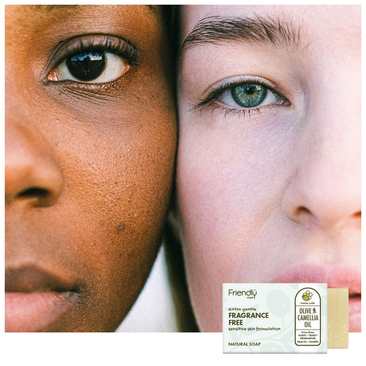 A close-up split portrait of two people' faces with the Friendly Soap 'Olive & Camellia Oil' soap bar package shown in the lower right corner.