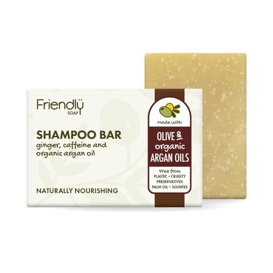 Friendly soap Shampoo Bar packaging shown in front of the actual bar, which is olive-beige with visible argan oil flecks. The box is cream-colored with brown and green accents, labeled 'Olive & organic Argan Oils'.