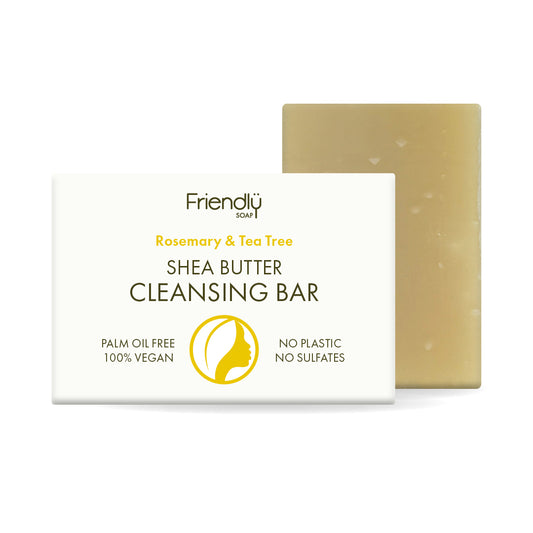 A bar of Friendly Soap Shea Butter Cleansing Bar, shown with its white packaging box in the foreground and the pale yellow-beige soap bar behind it on a white background.