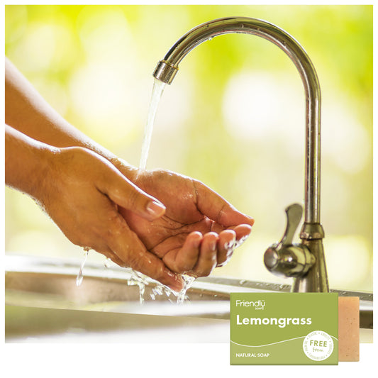 woman's hands washing at the kitchen sink