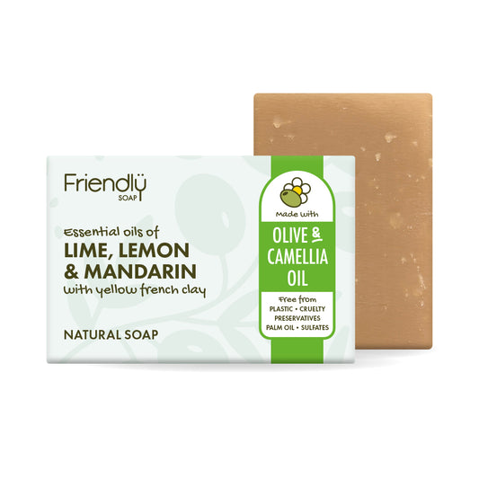 A bar of Friendly olive oil soap shown with its white and green packaging box and the natural tan soap bar behind it on a white background.