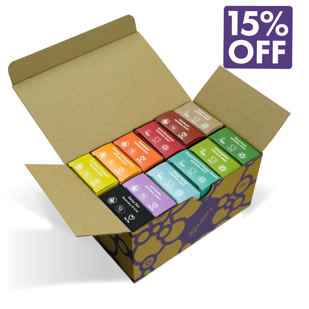 Open cardboard box with 12 colorful natural soap boxes inside, featuring a 15% off discount label.