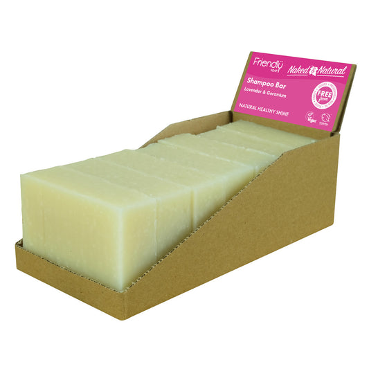 Display of Naked & Natural shampoo bars with a pink label on plastic-free packaging
