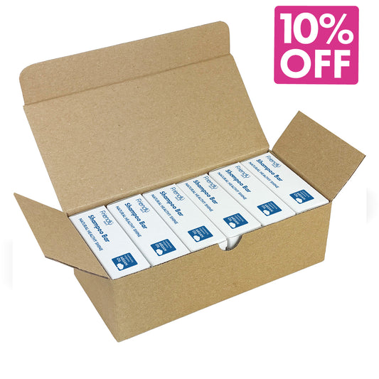 An open brown cardboard box containing six fragrance free shampoo bars with blue labels, shown on a white background with a pink '10% OFF' promotional badge in the top right corner.