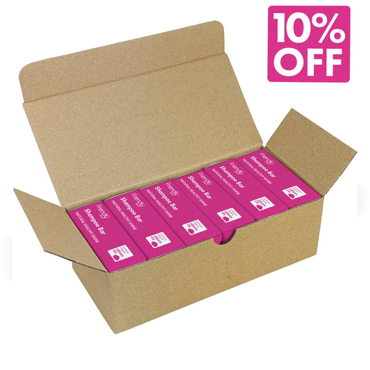 An open brown cardboard shipping box containing multiple pink boxes of Bar shampoo, with a pink '10% OFF' badge in the top right corner on a white background.