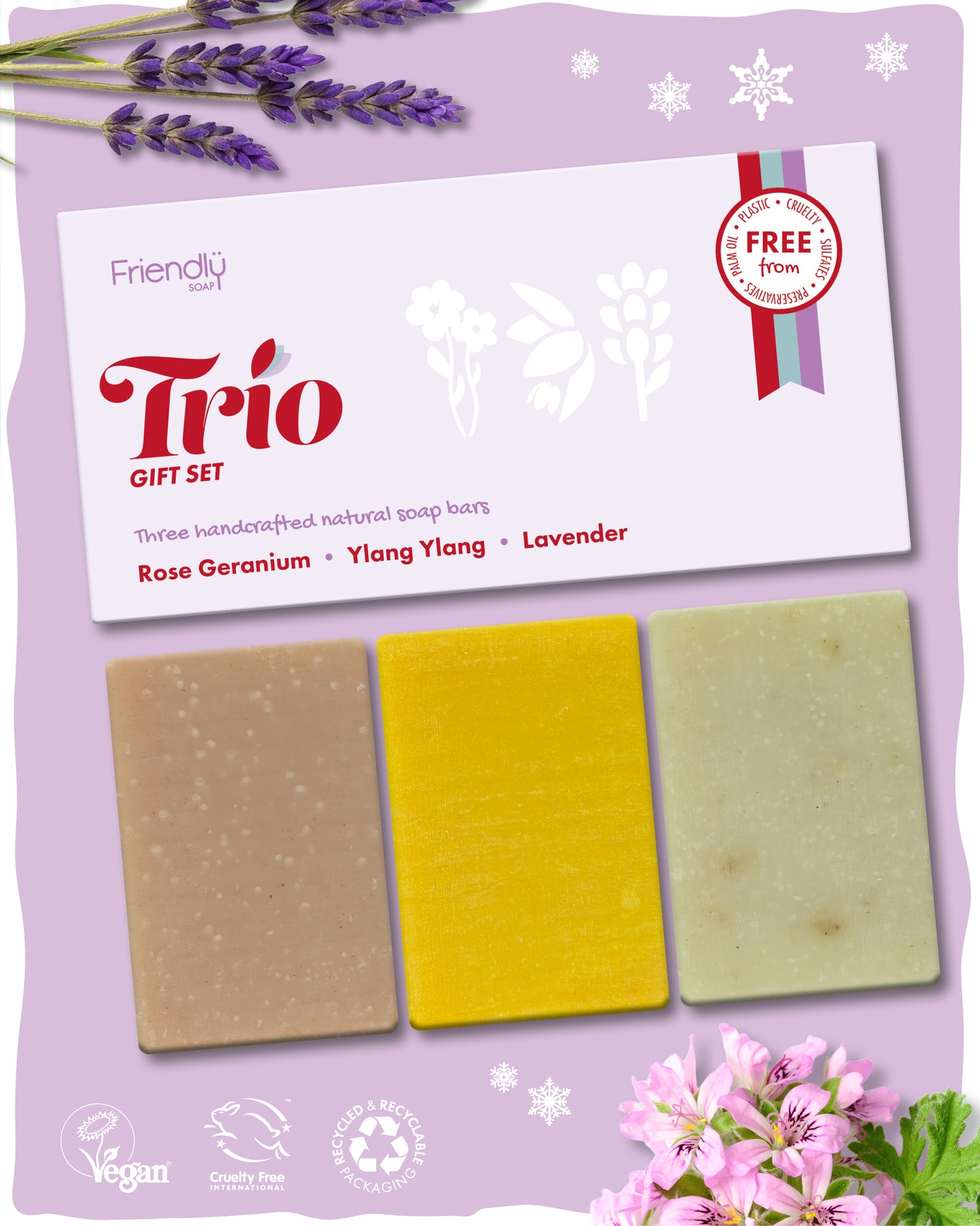 Friendly soap trio gift set surrounded by lavender and rose geranium flowers
